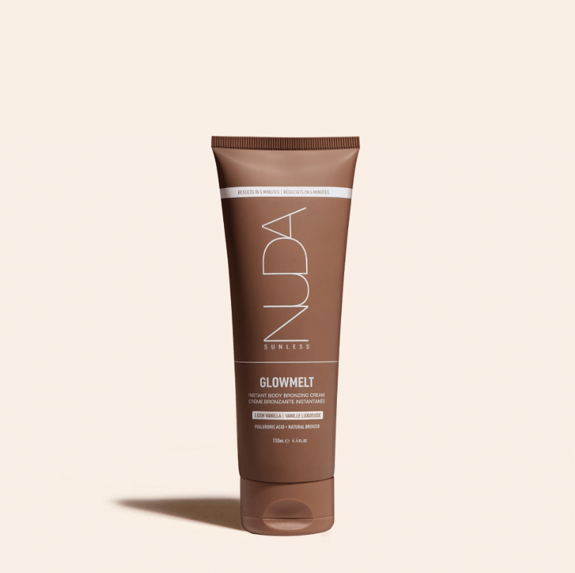 Tube of NUDA Sunless GlowMelt instant body bronzing cream on a light beige background (bronzer product).
